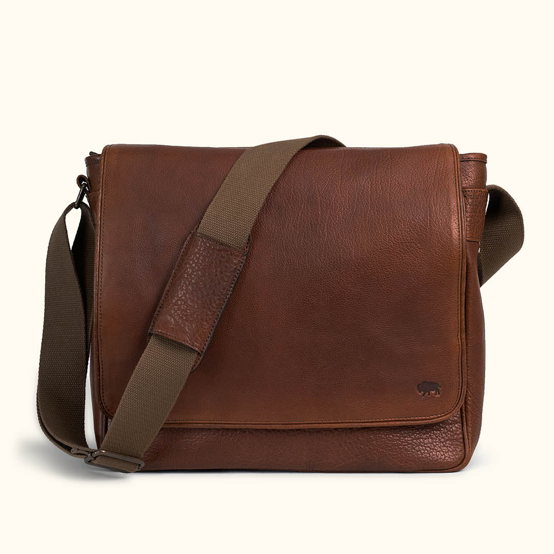 Limited Edition Roosevelt Buffalo Leather Messenger Bag — full-grain water buffalo hide with pebble grain finish and adjustable canvas strap